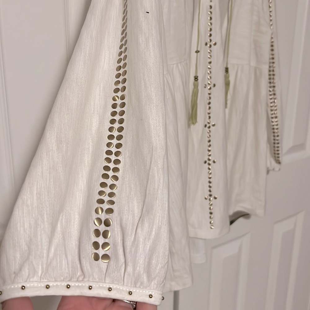 Á la cart blouse with gold studs & tassels.